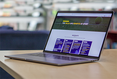 Laptop on a desk with the clearinghouse on screen