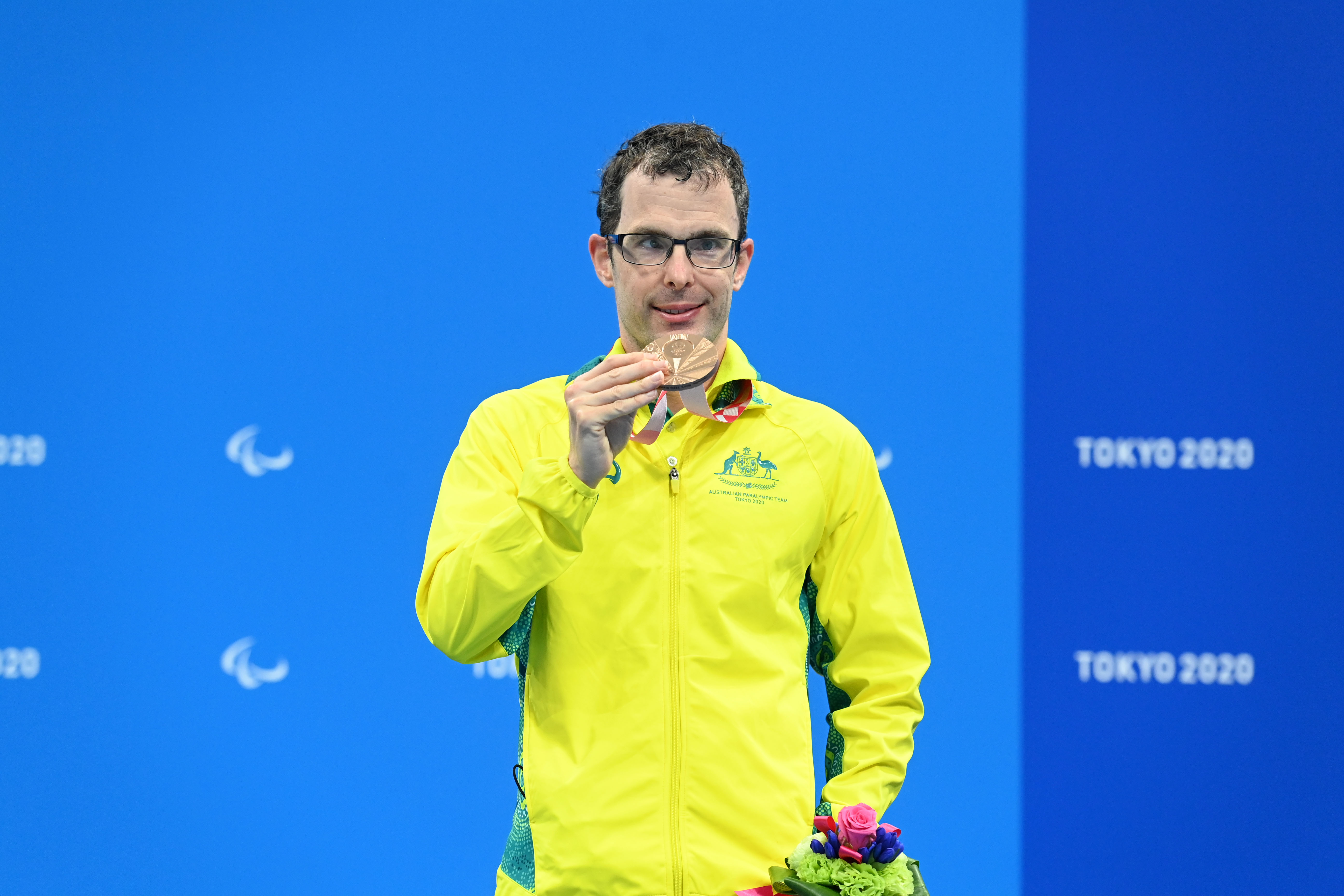 Image of Para-swimmer Matt Levy with his bronze medal won at the Tokyo 2020 Paralympic Games