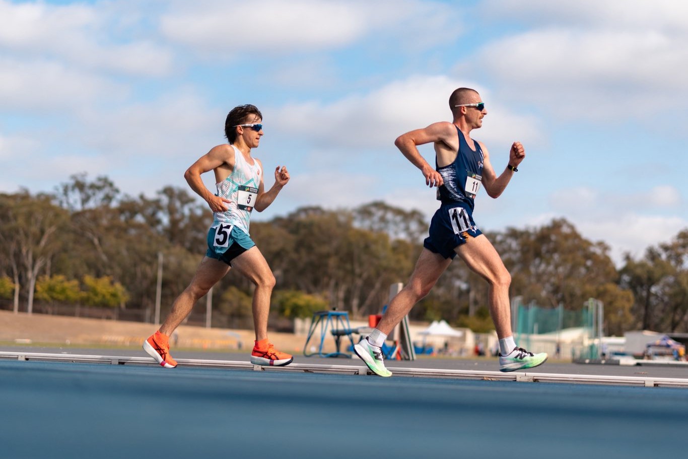 Racewalkers Isaac Beacroft and Declan Tingay competing on the AIS Athletics Track.