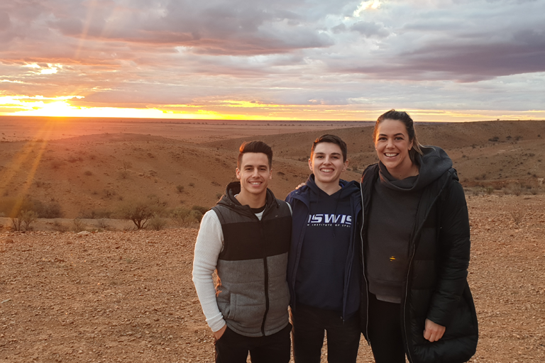 Declan Stacey, Gordon Allan and Jenna O’Hea at sunset in Broken Hill.