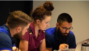 Three people working together
