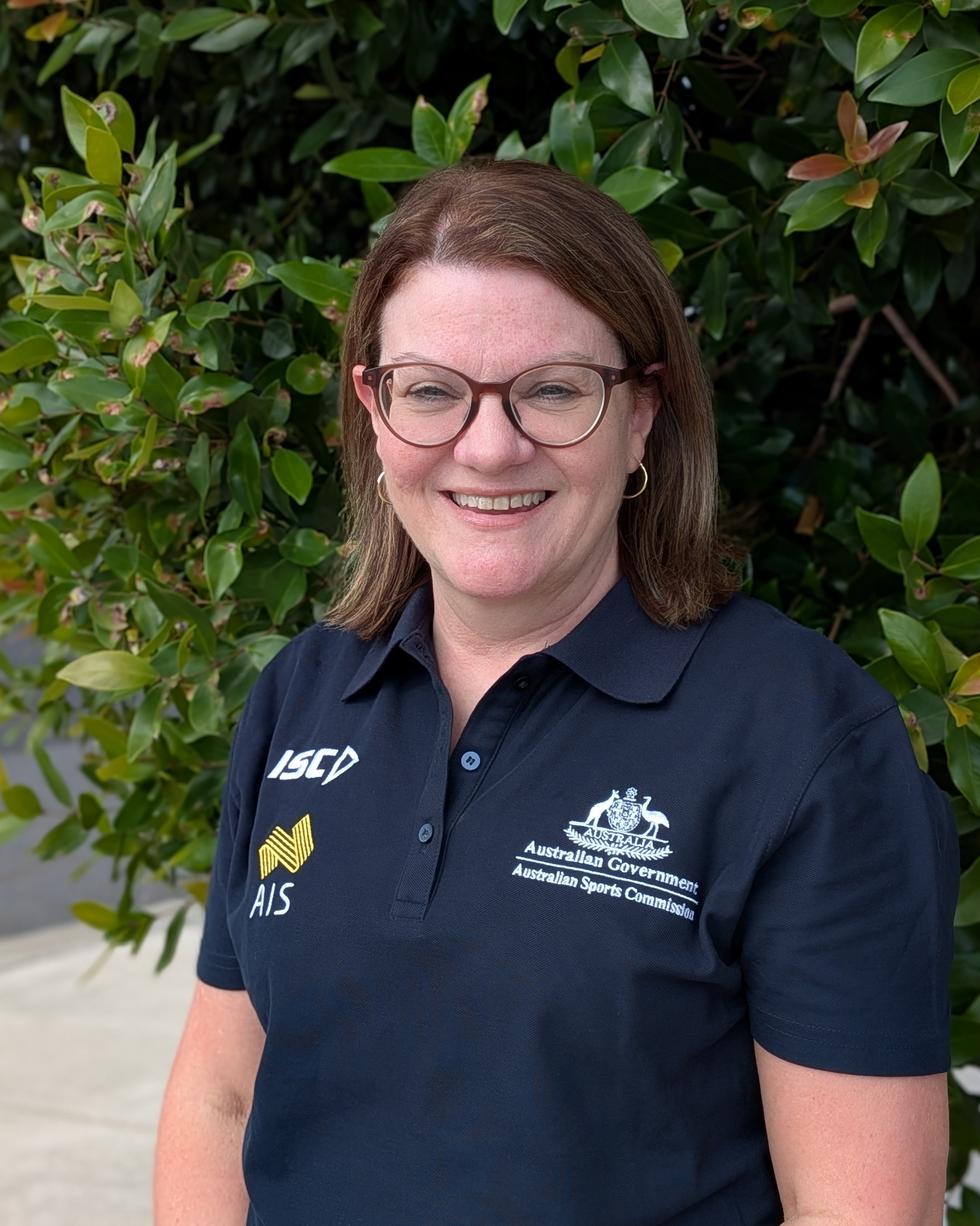 Headshot of Kylie Andrew wearing AIS polo