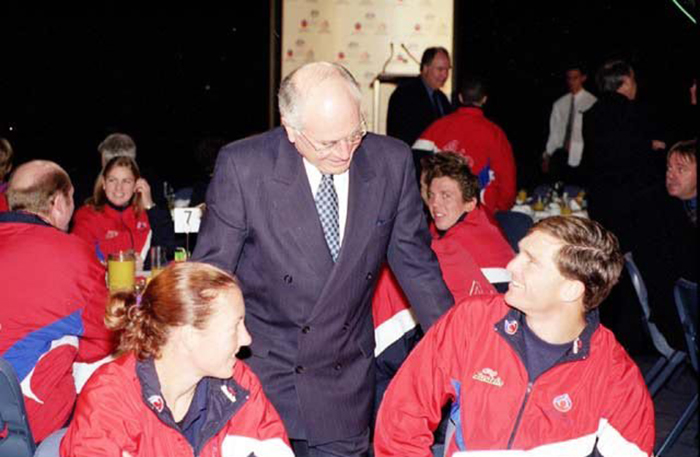 Prime Minister John Howard chatting with the AIS Commonwealth Games team at a farewell breakfast 2002