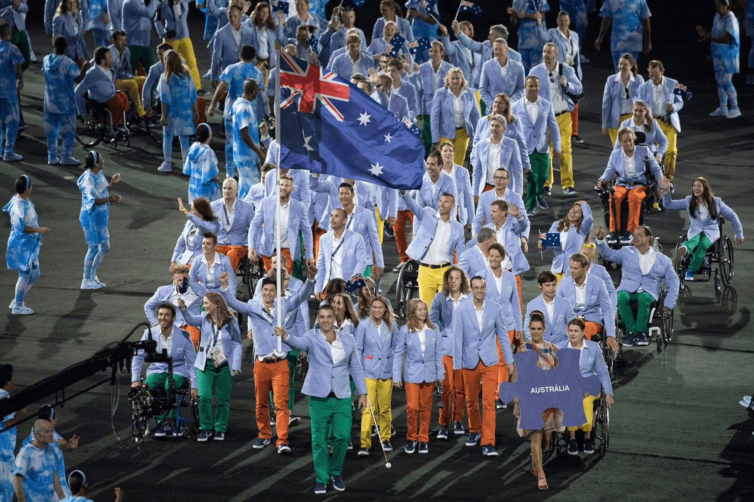 Flag bearer Bradley Ness leads members of the Australian Paralympic Team into the 2016 Rio Games opening ceremony.