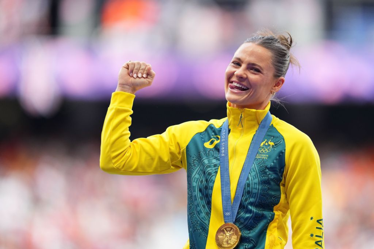 Gold medalist Nina Kennedy celebrating wearing her medal at the Paris 2024 Olympic Games.