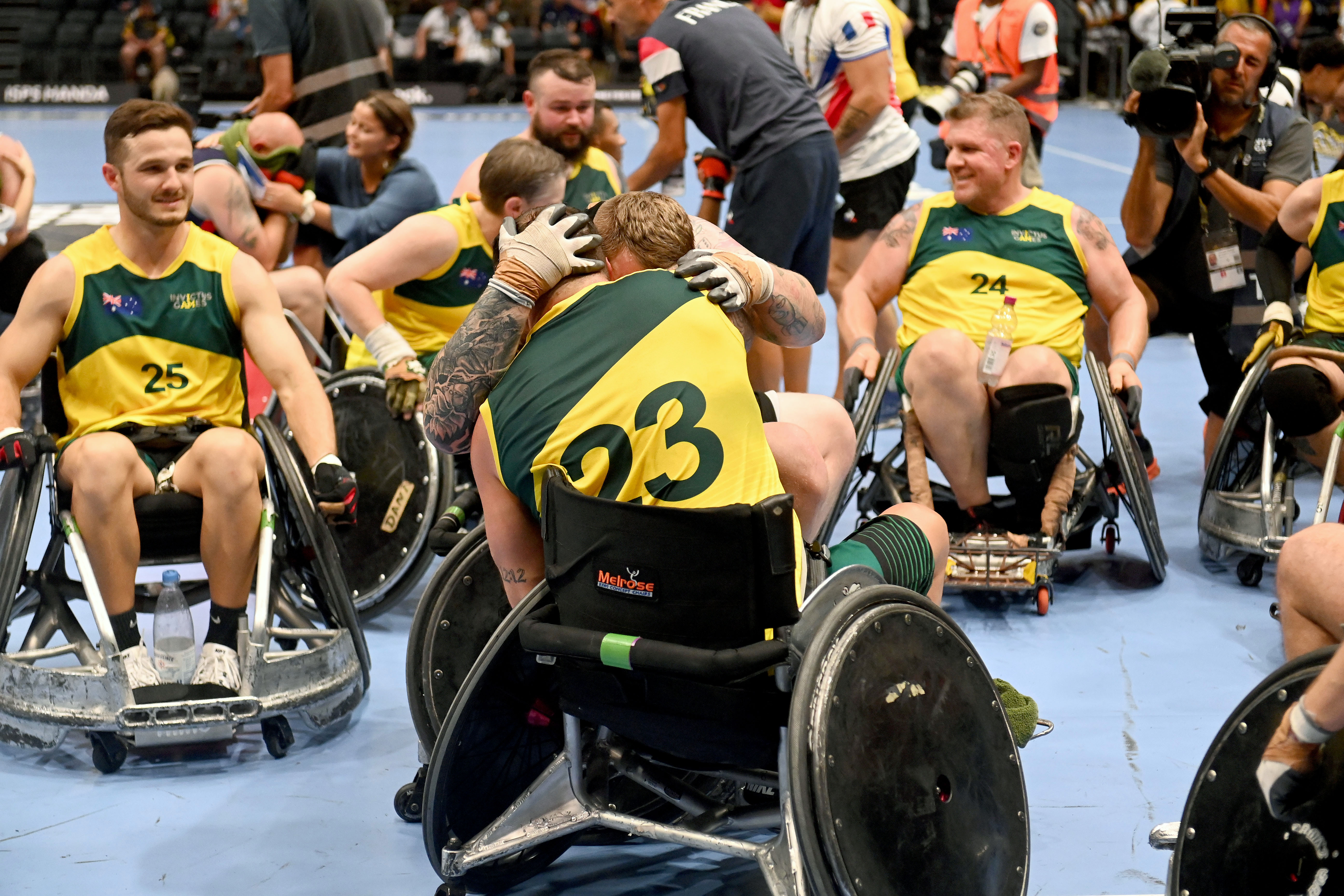 The Wheeling Diggers, Team Invictus Australia’s wheelchair rugby team, embrace after their bronze medal game in Düsseldorf 2023.