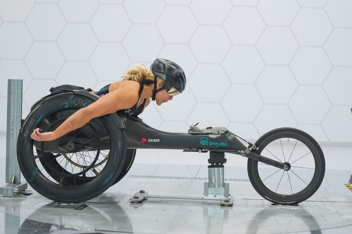 Madison de Rozario testing her racing wheelchair in the wind tunnel at the Australian Centre for Sports Aerodynamics