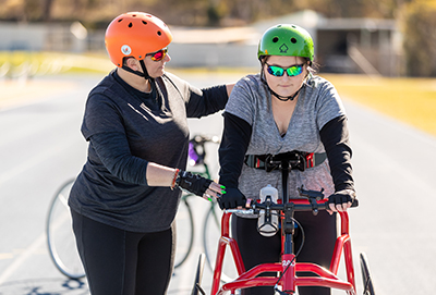 A coach talking to a frame running athlete