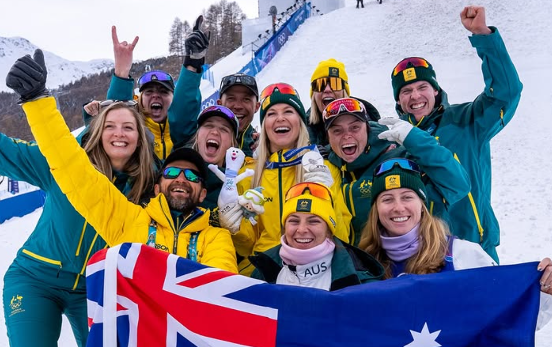 Coach Renee McElduff with Aerials athletes and support team at Milano Cortina 2026