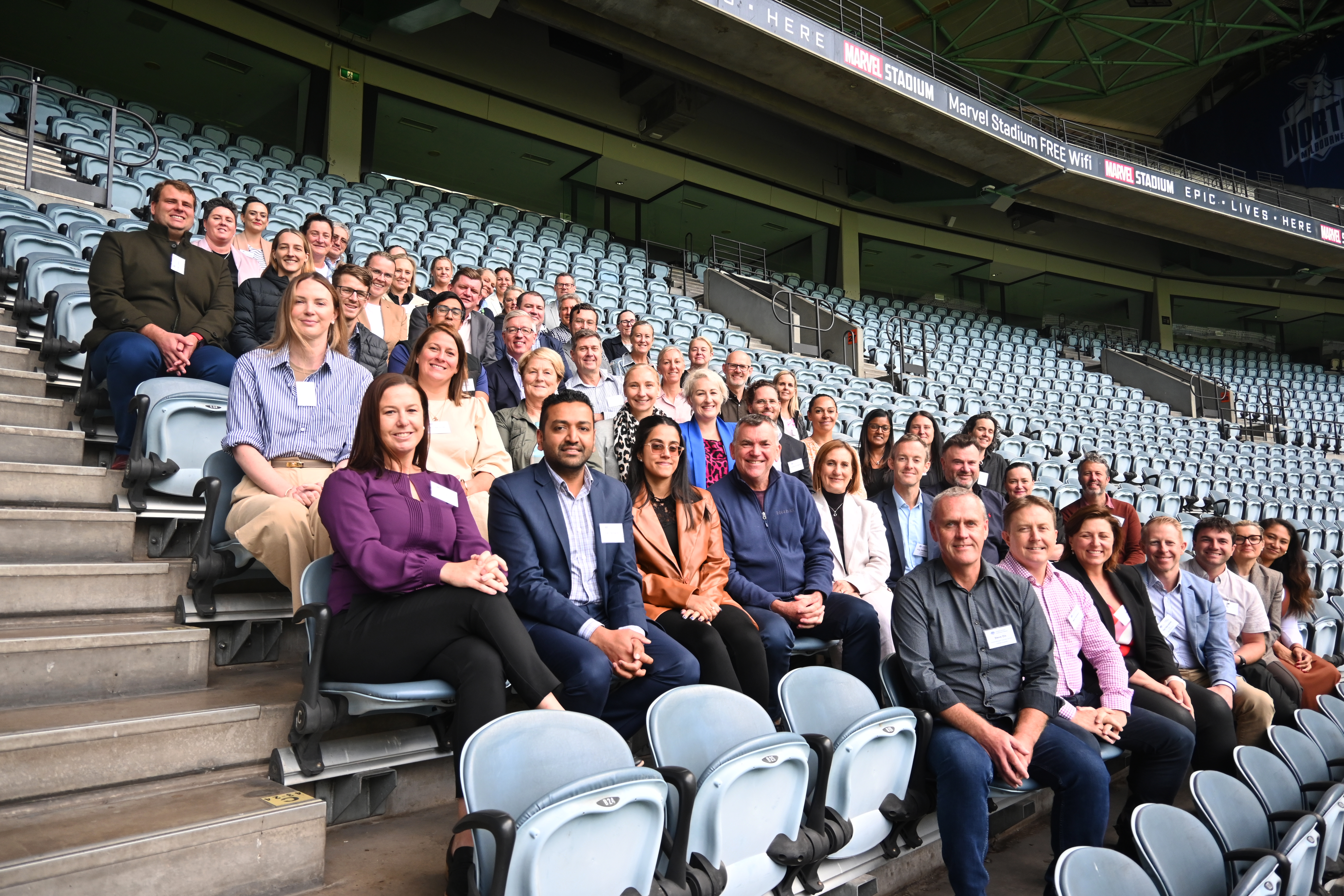 More than 60 CEOs and executives from the sport sector sitting in stadium seating at Marvel Stadium in Melbourne