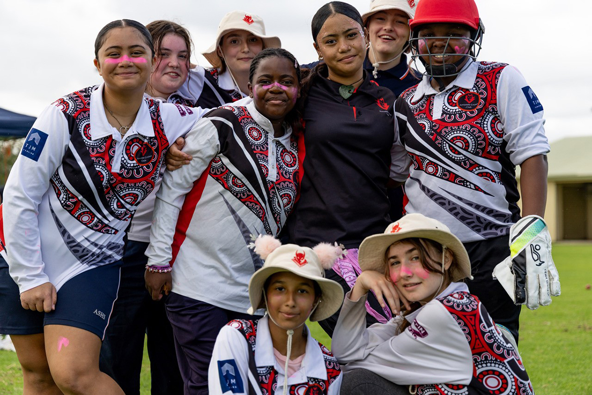 Image of teenage girls on the cricket pitch