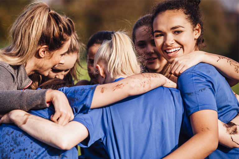 Generic girls team in a huddle