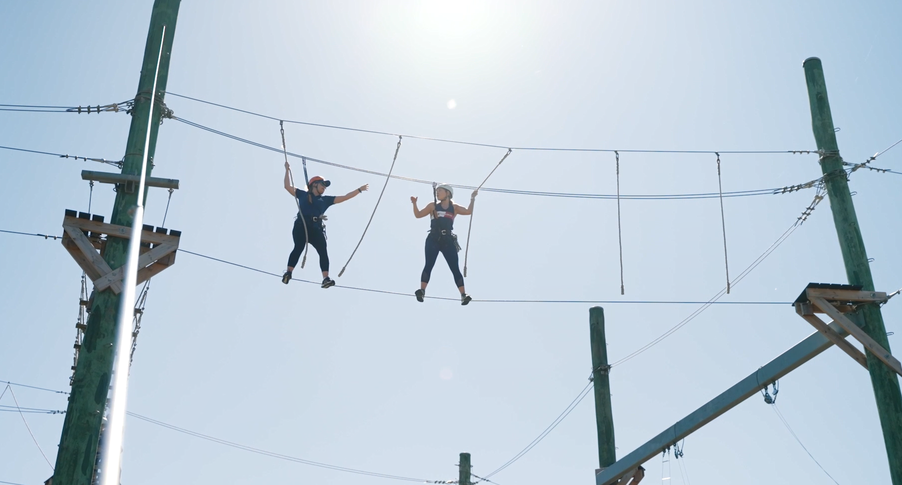 two people on the high ropes course
