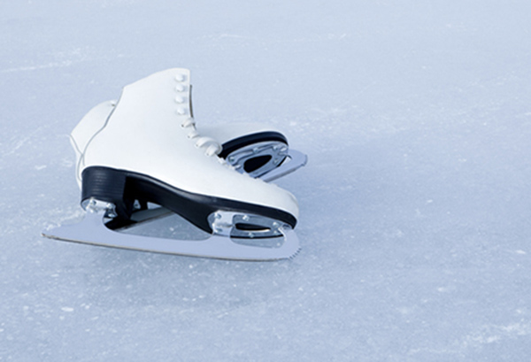 Ice skates laying on the ice