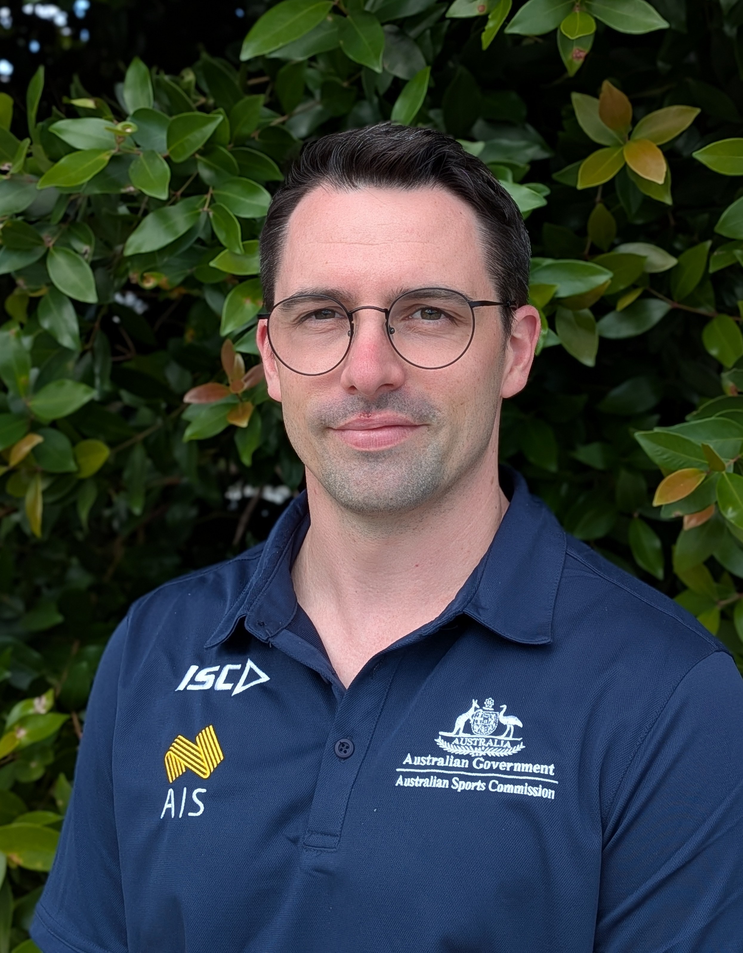 Headshot of Lachlan Mitchell wearing AIS polo