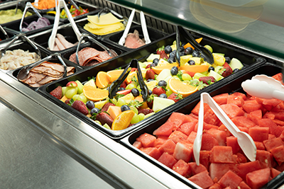 Bain-marie setup in the dining hall, with fruit