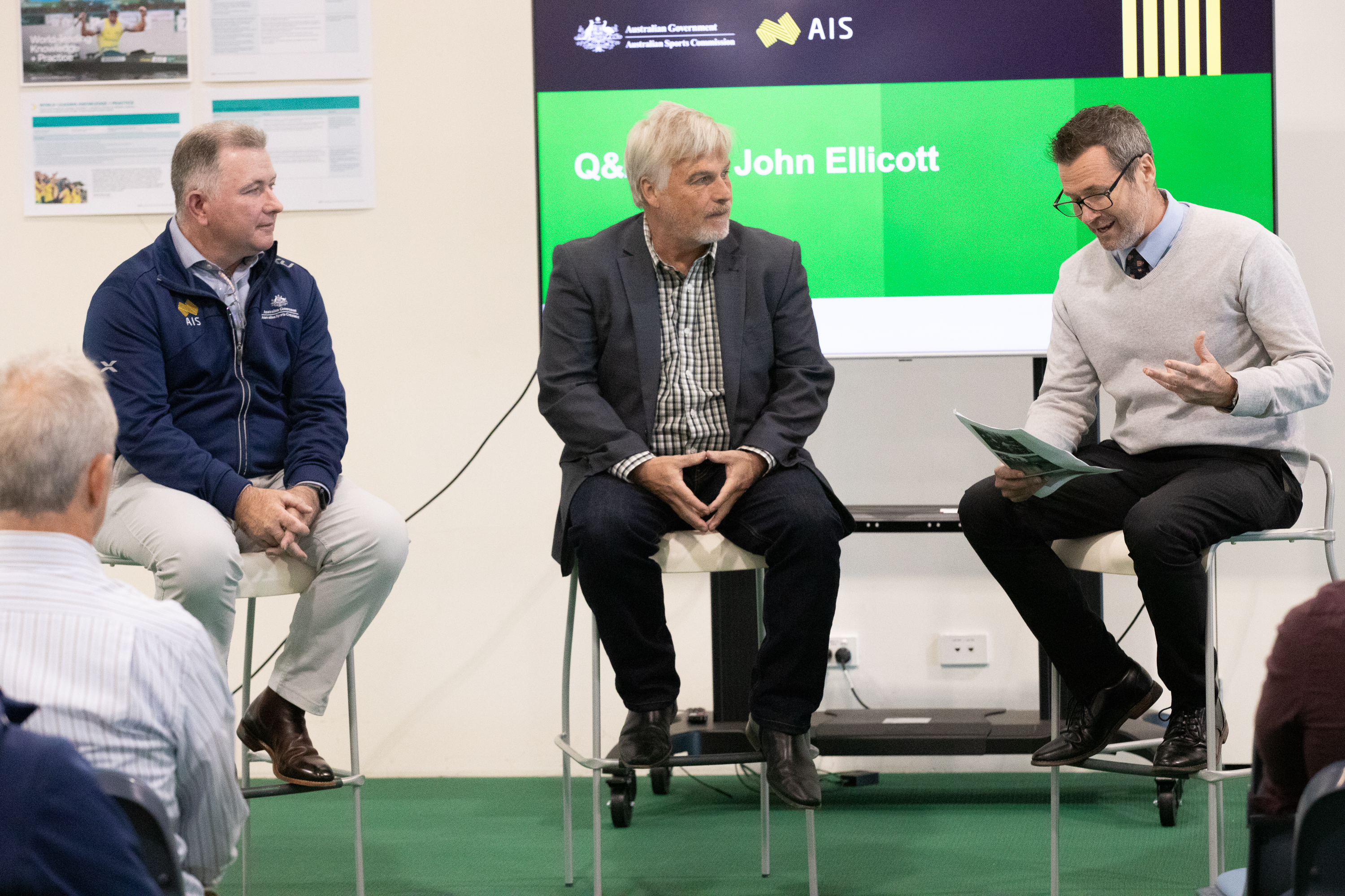 ASC Research and Innovation Manager Tim Kelly (R) and AIS Performance Services Manager Julian Jones (L) speak with John Ellicott (C), the son of AIS pioneer Bob Ellicott.