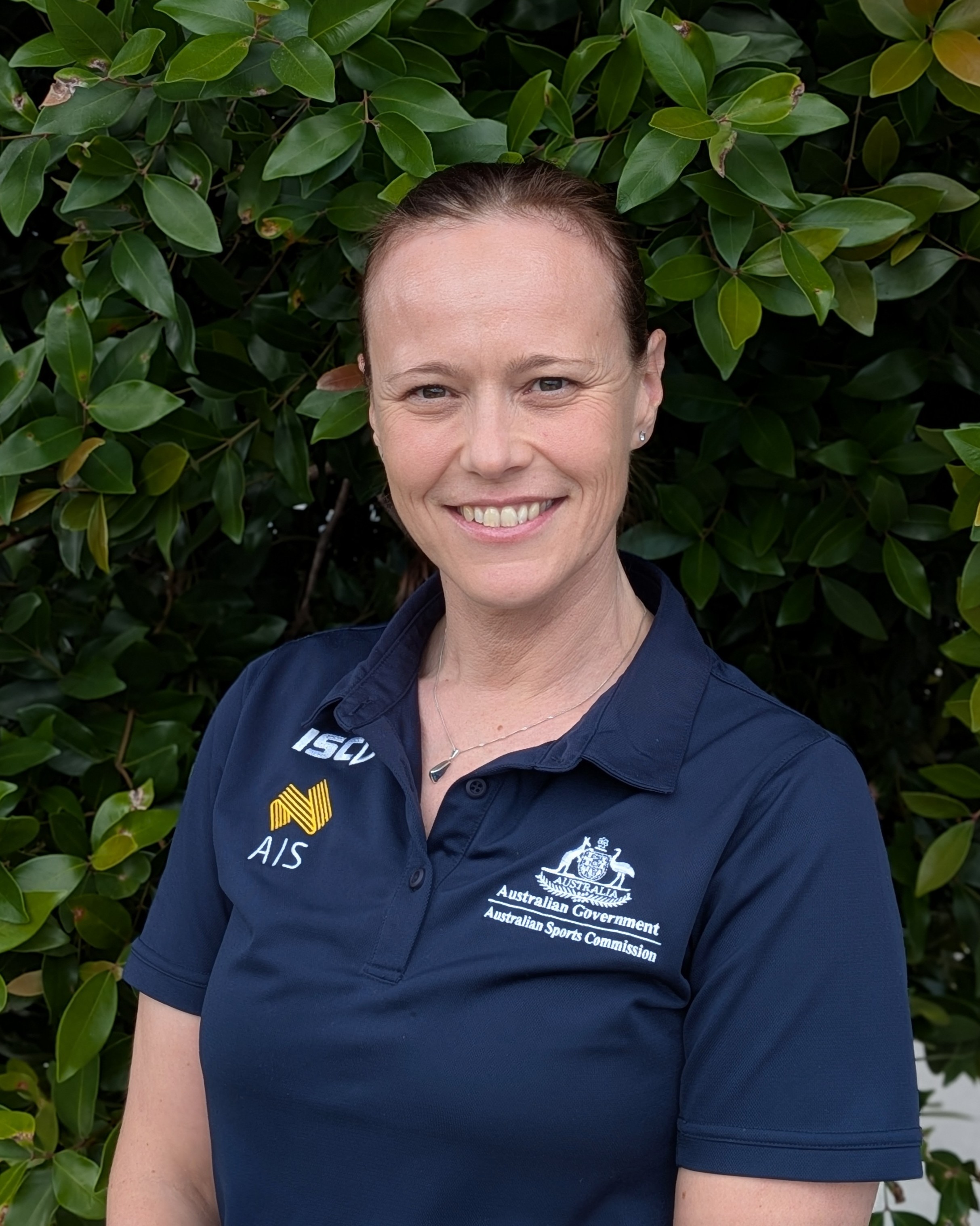 Headshot of Alison Alcock wearing AIS polo