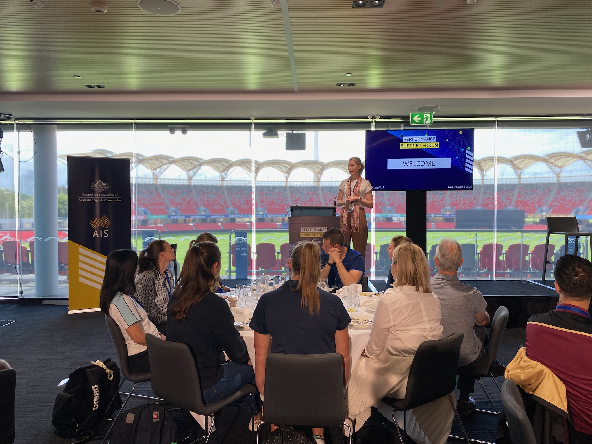 Female welcoming the participants