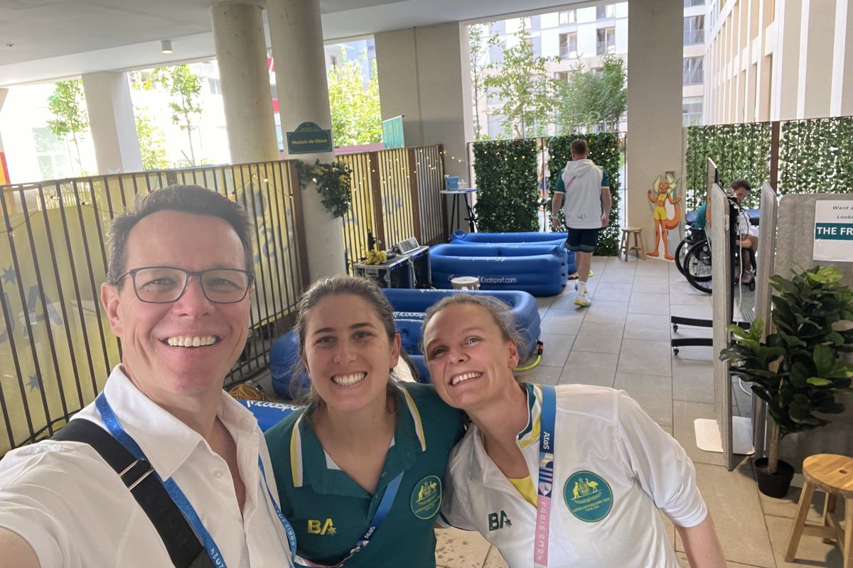 ASC CEO Kieren Perkins pictured at the Athlete Village Recovery Hub with Dr Peta Maloney and Dr Steph Davies.