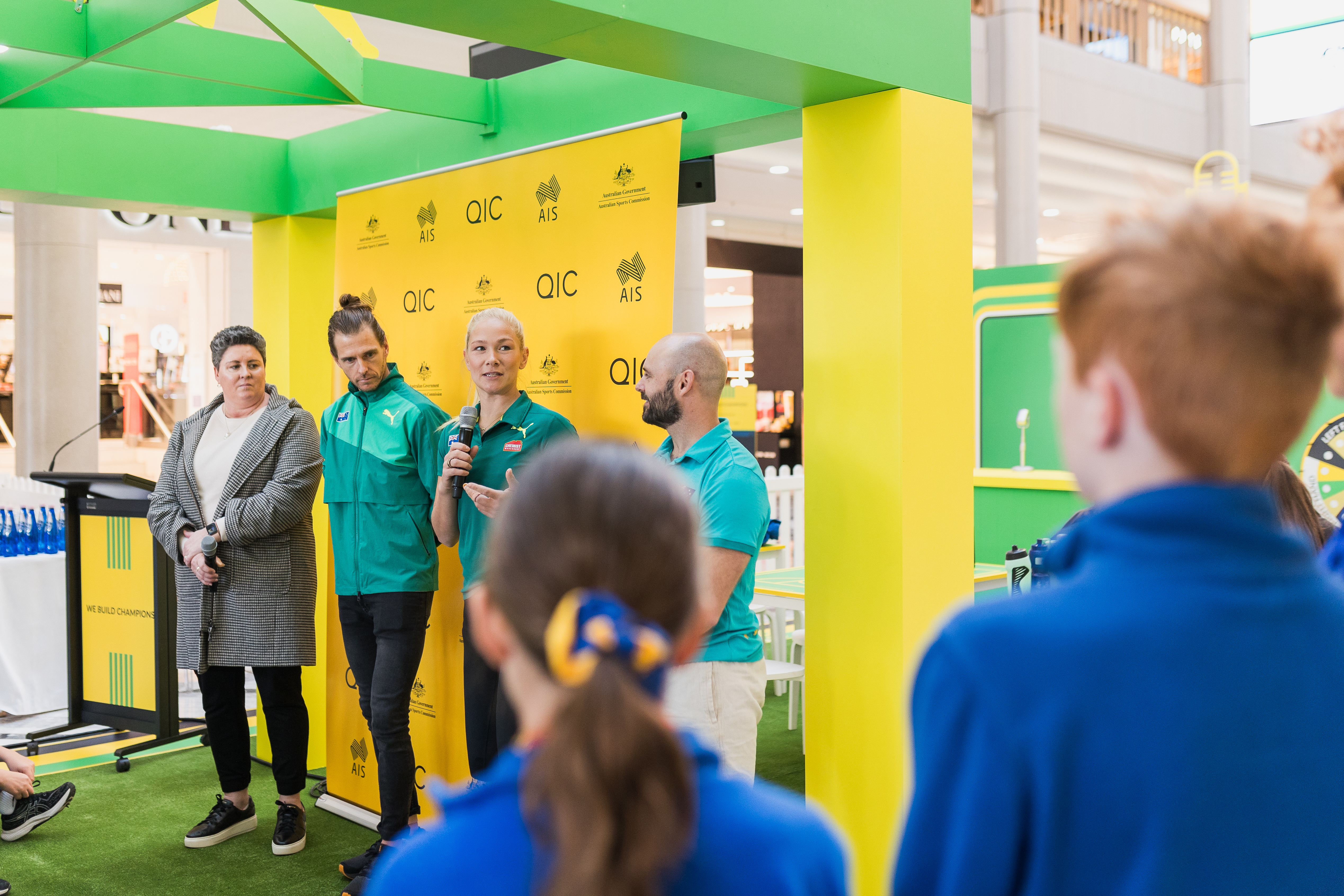 Image of students asking athletes questions at the launch