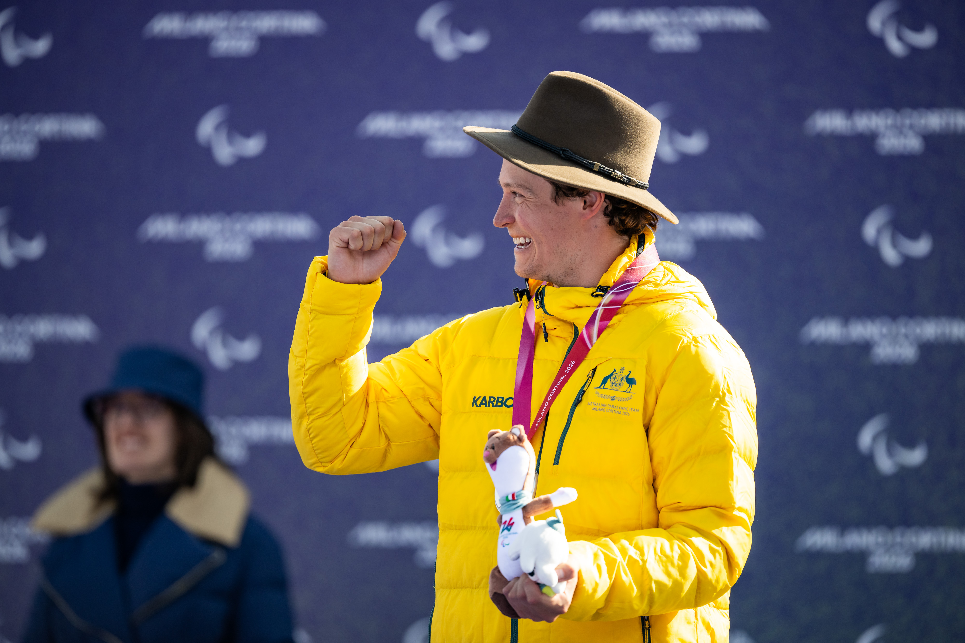 Australian Paralympian Ben Tudhope celebrates a medal in Milano Cortina