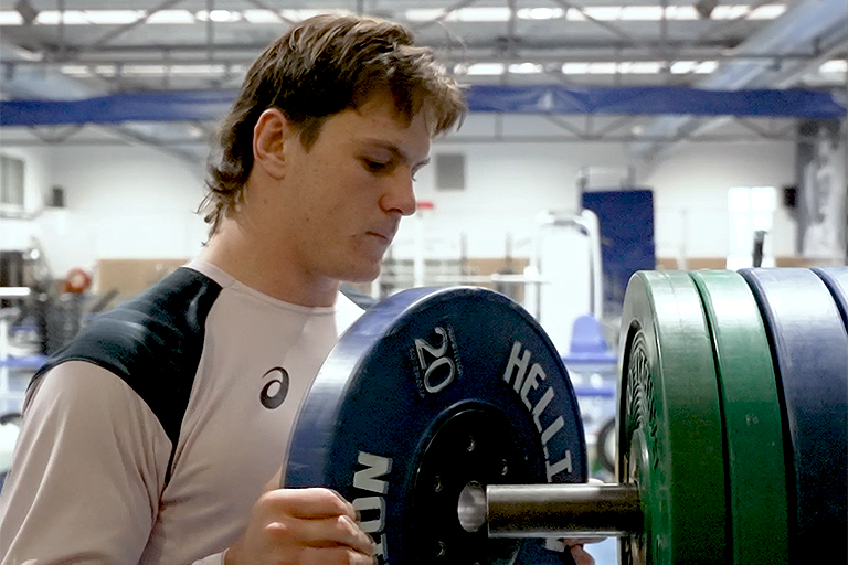 Tom Hooper shifts weights at the AIS gym