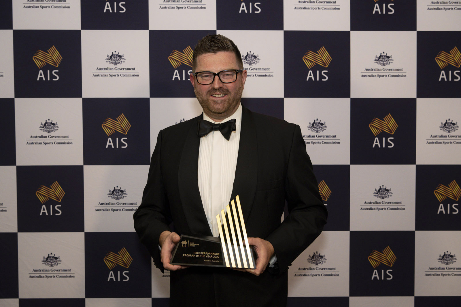 Athletics Australia's General Manager - High Performance, Andrew Faichney, with the award for High Performance Program of the Year.