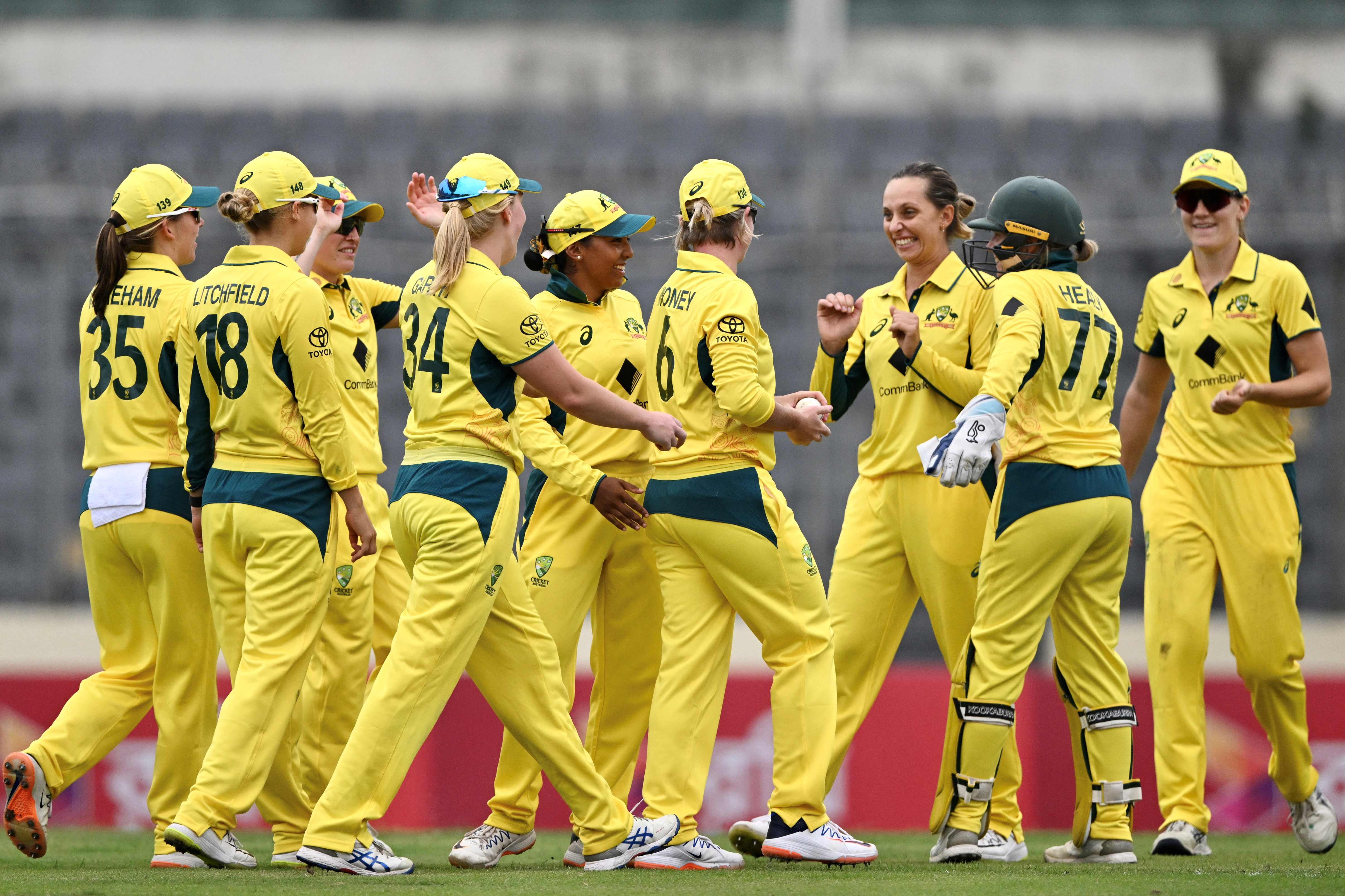 Australia's players celebrate during the first one-day international cricket match between Bangladesh and Australia.