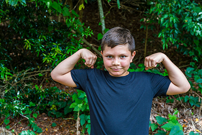 Boy flexing his biceps