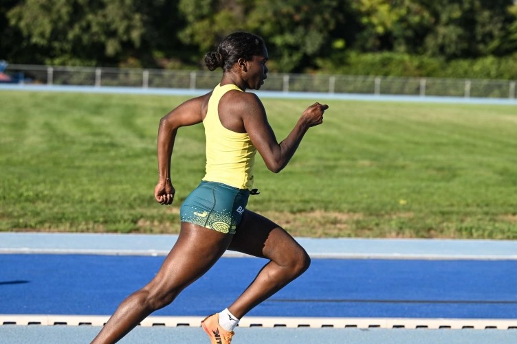 Paralympic track star Telaya Blacksmith running on an athletics track