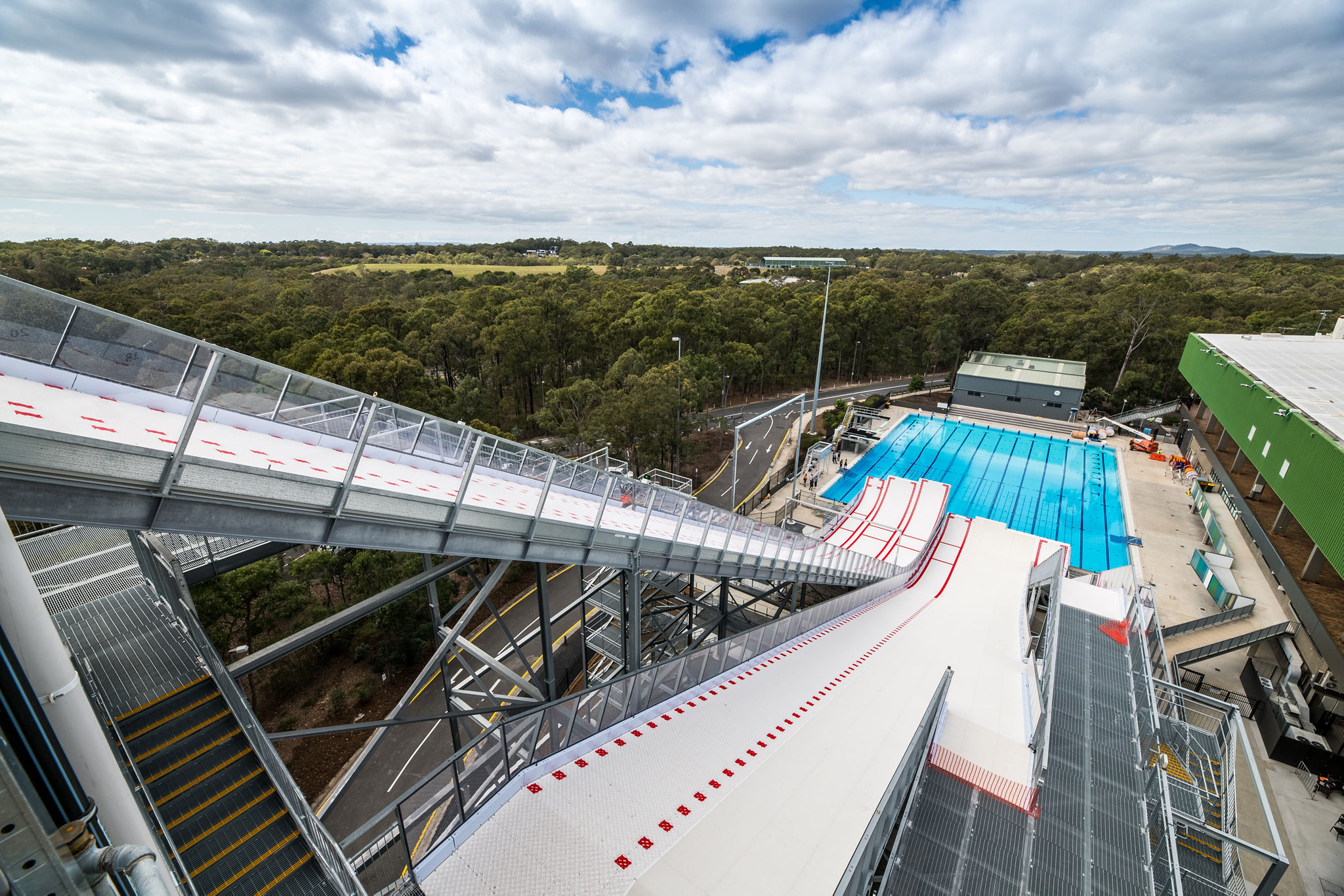 Image supplied by Australian Olympic Committee.
From the top of the 37 metre high facility, athletes can reach maximum speeds of over 70km/h and launch up to 17 metres above the water, trialling and perfecting aerial manoeuvres in the safety of the water-landing before transferring them to the snow.