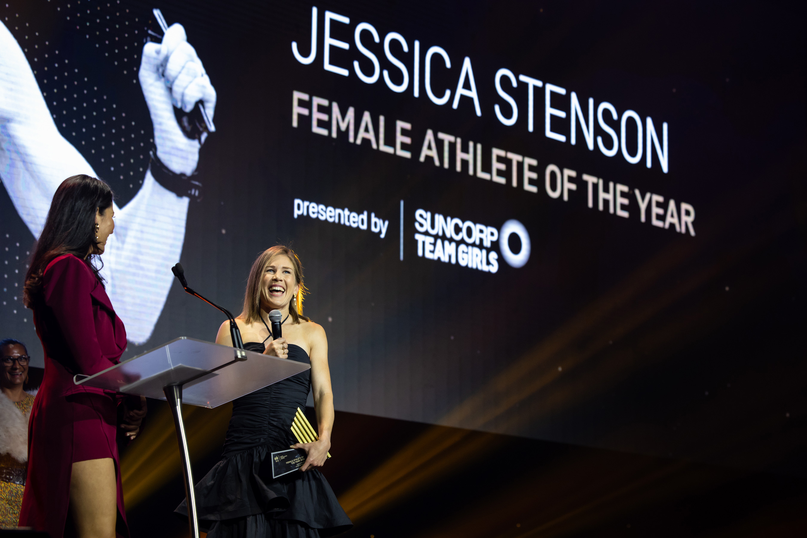 Jessica Stenson on stage with master of ceremonies Mel McLaughlin after being named female athlete of the year at the ASPAs in Sydney.