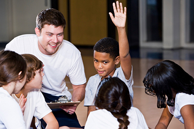 C4S-image-coach taking to young children