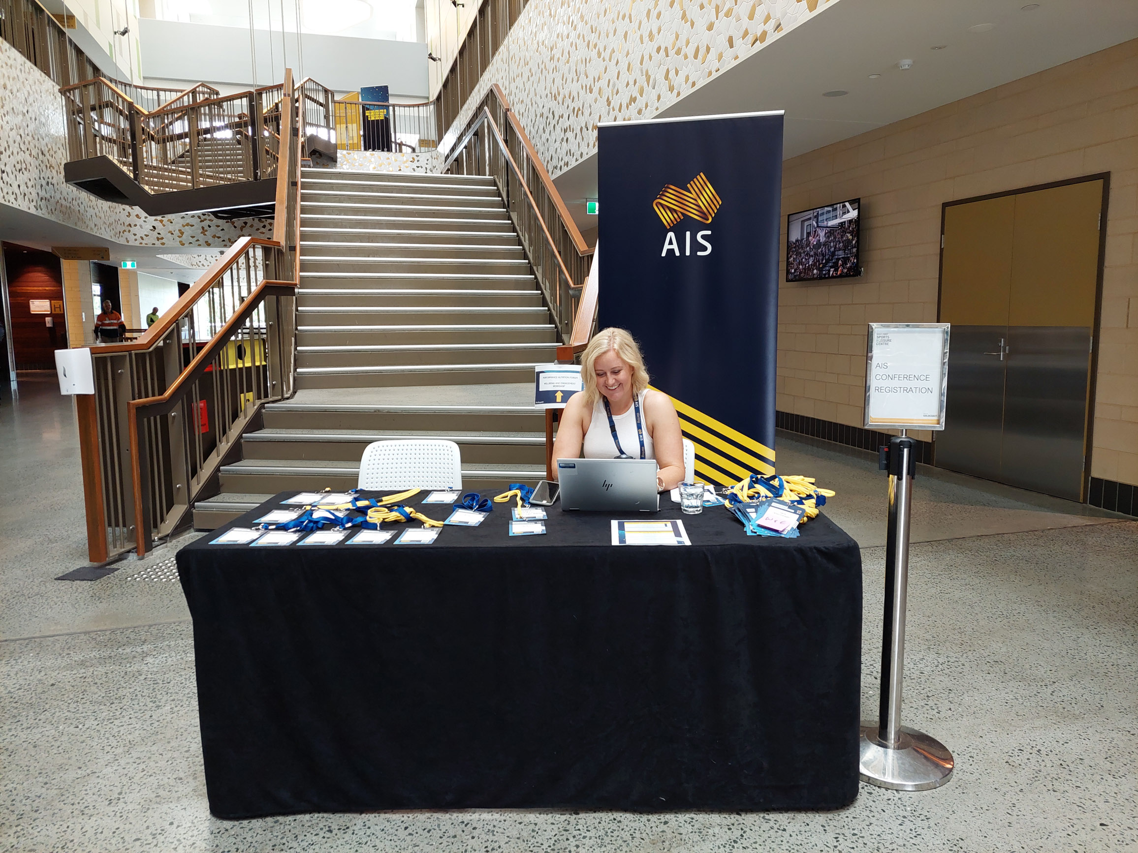 Female sitting at desk typing on laptop