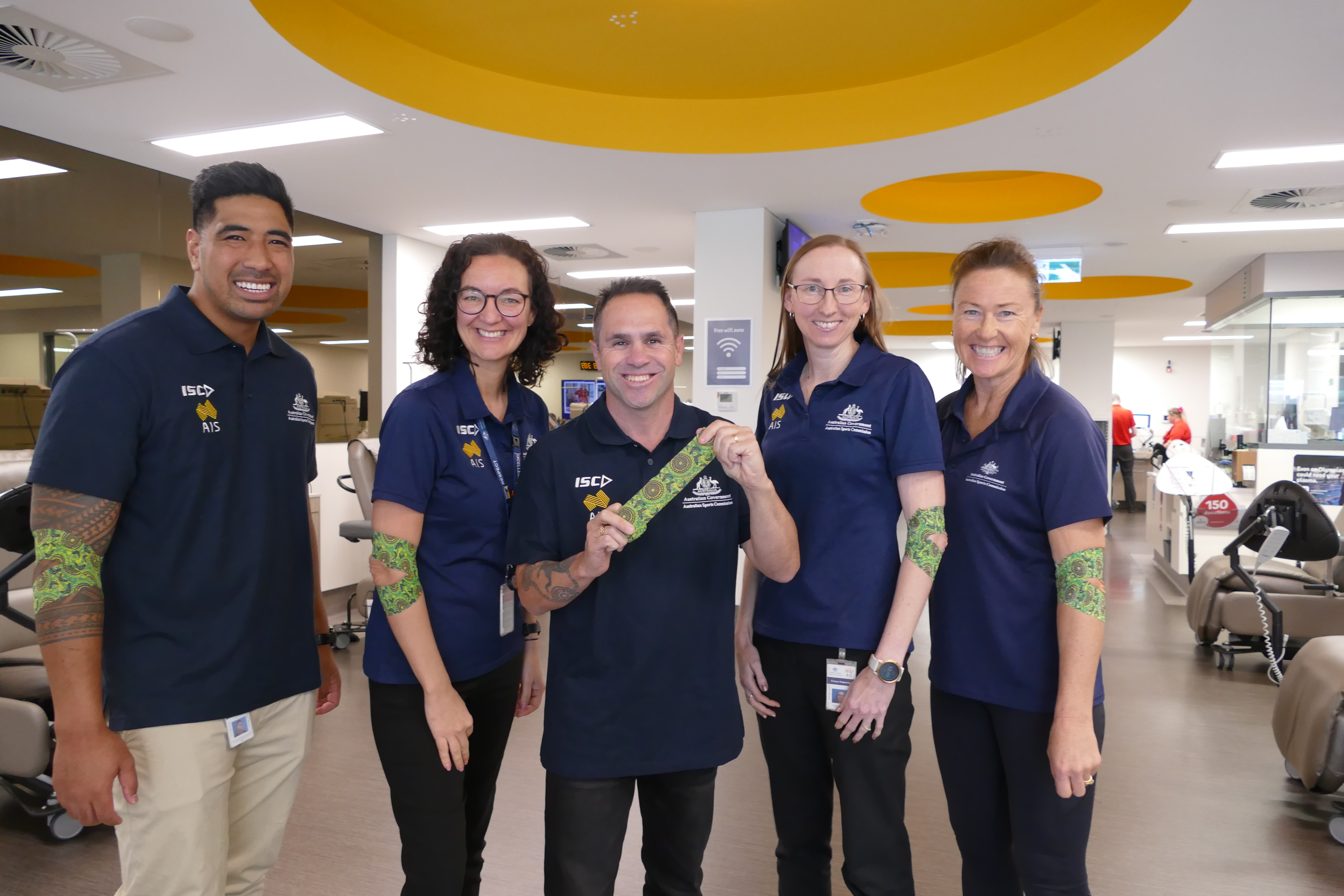 Brad with ASC staff after donating plasma.