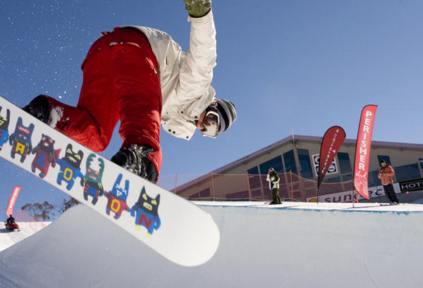 Snowboarding athlete in the half pipe at Perisher
