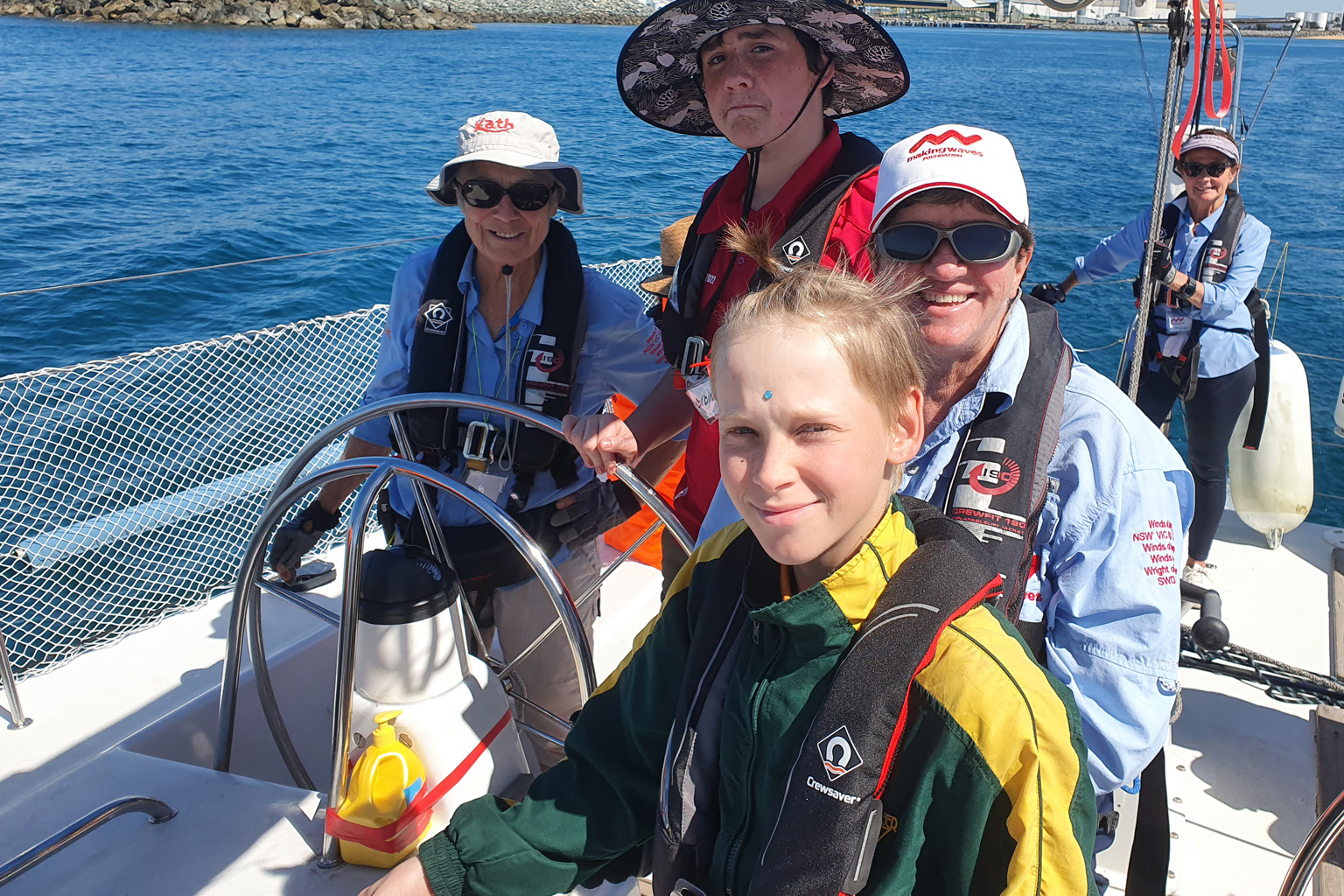 Students and instructors enjoy sailing as part of the Winds of Joy program near Mackay.