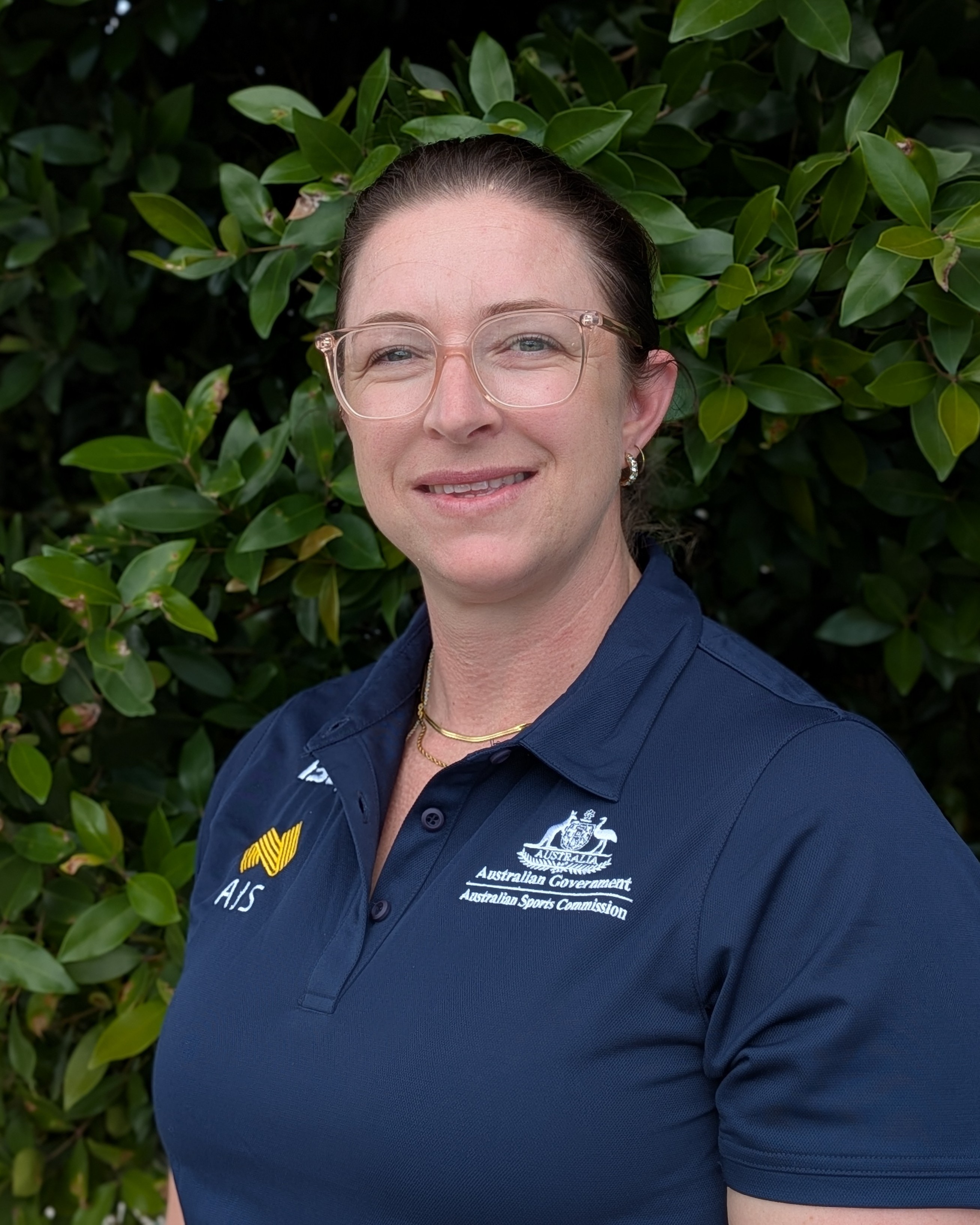 Headshot of Kate Mcintosh in AIS polo