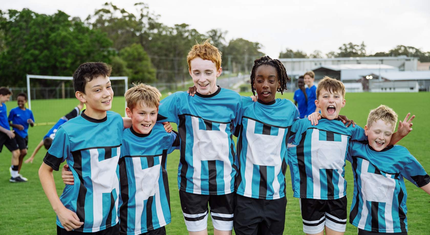 Male youth athletes side by side