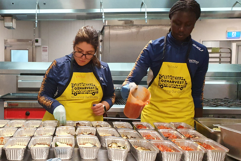 Athletes gathered for a group photo at Oz Harvest