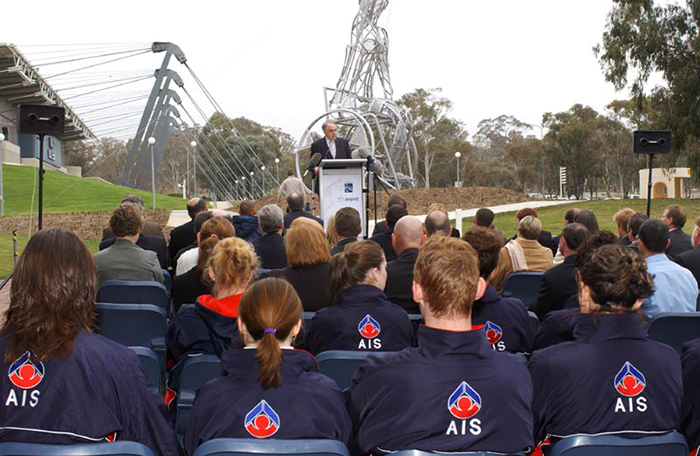 AIS Athletes listen to Senator Rod Kemp Minister for the Arts at the AMP Olympic Sculptures launch 2003
