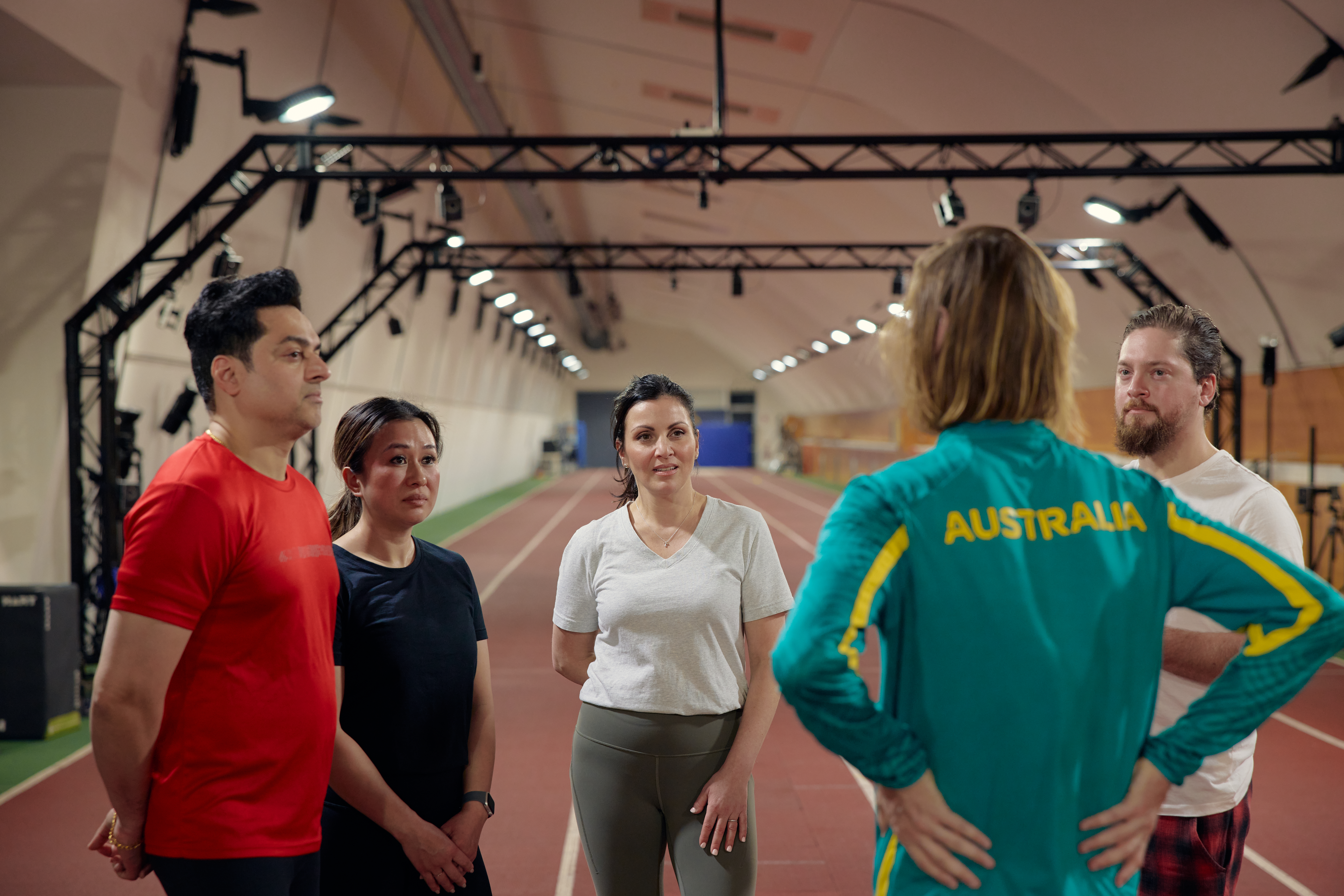 Tour group standing around athlete