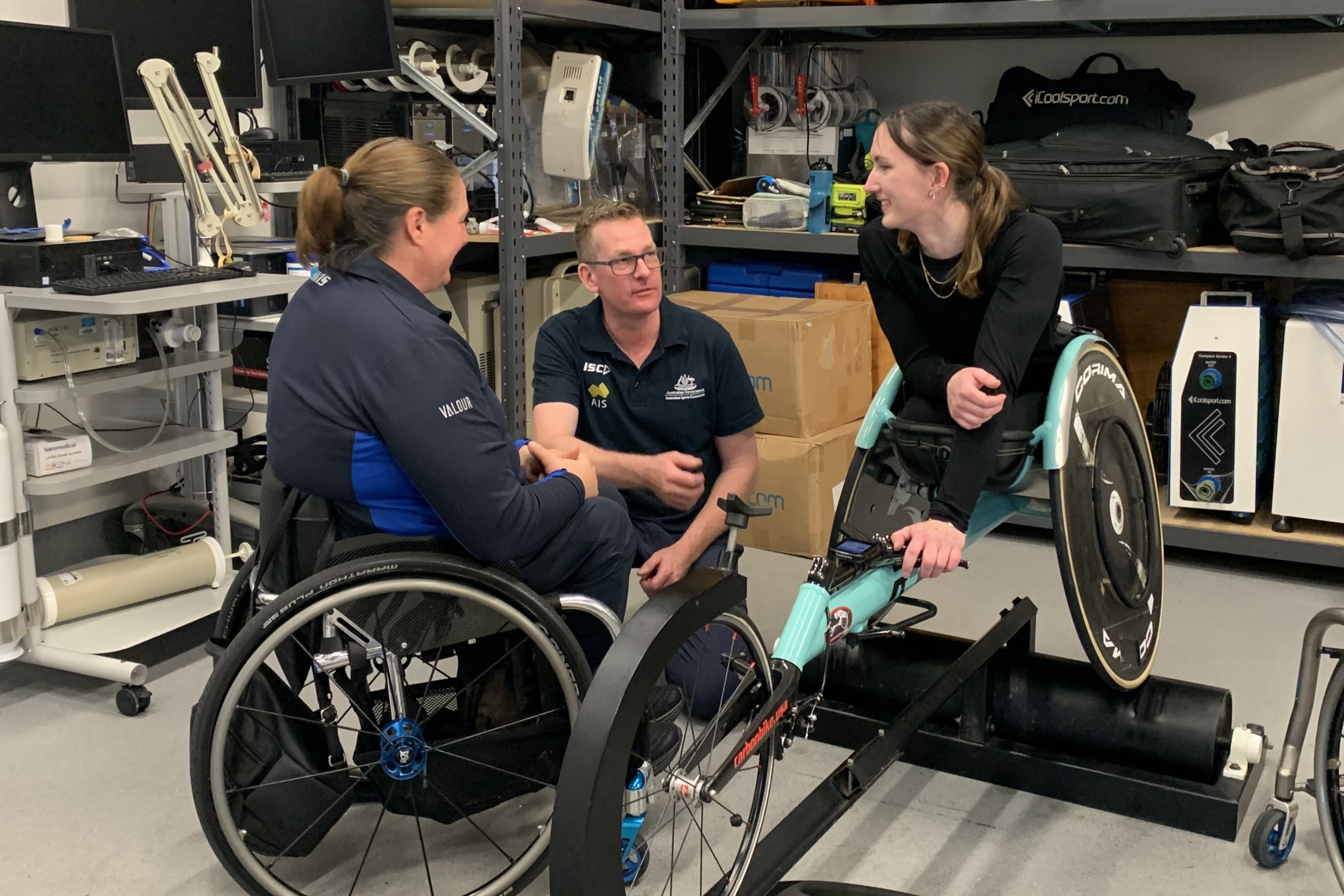 Aimee Fisher with her coach Louise Sauvage and AIS Engineering Lead Andy Richardson.