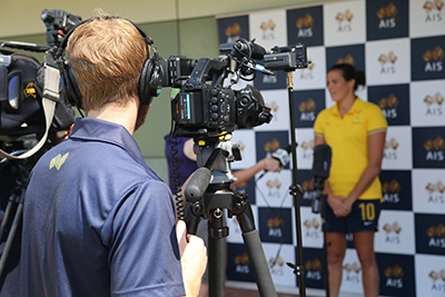 An athlete being interviewed by the media