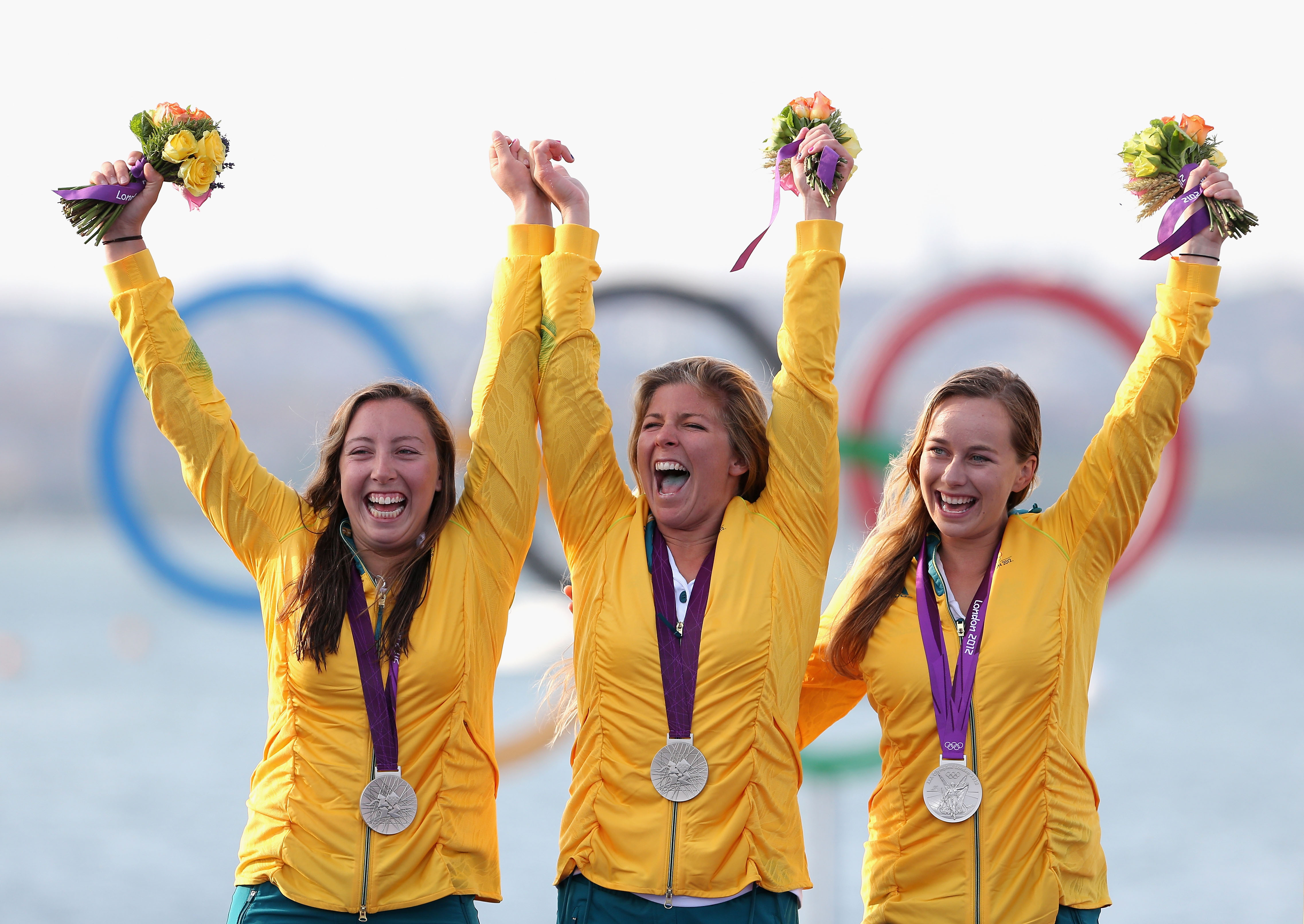 Silver medallists (from left) Nina Curtis, Lucinda Whitty and Olivia Price celebrate following the Women's Elliot 6m WMR Sailing at the London 2012 Olympics.