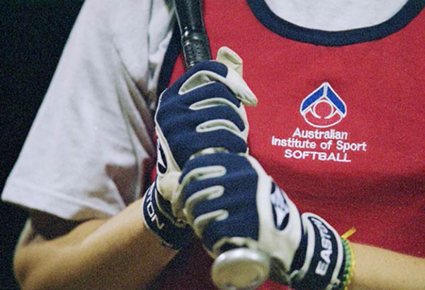 Close up of a softball athlete holding a bat