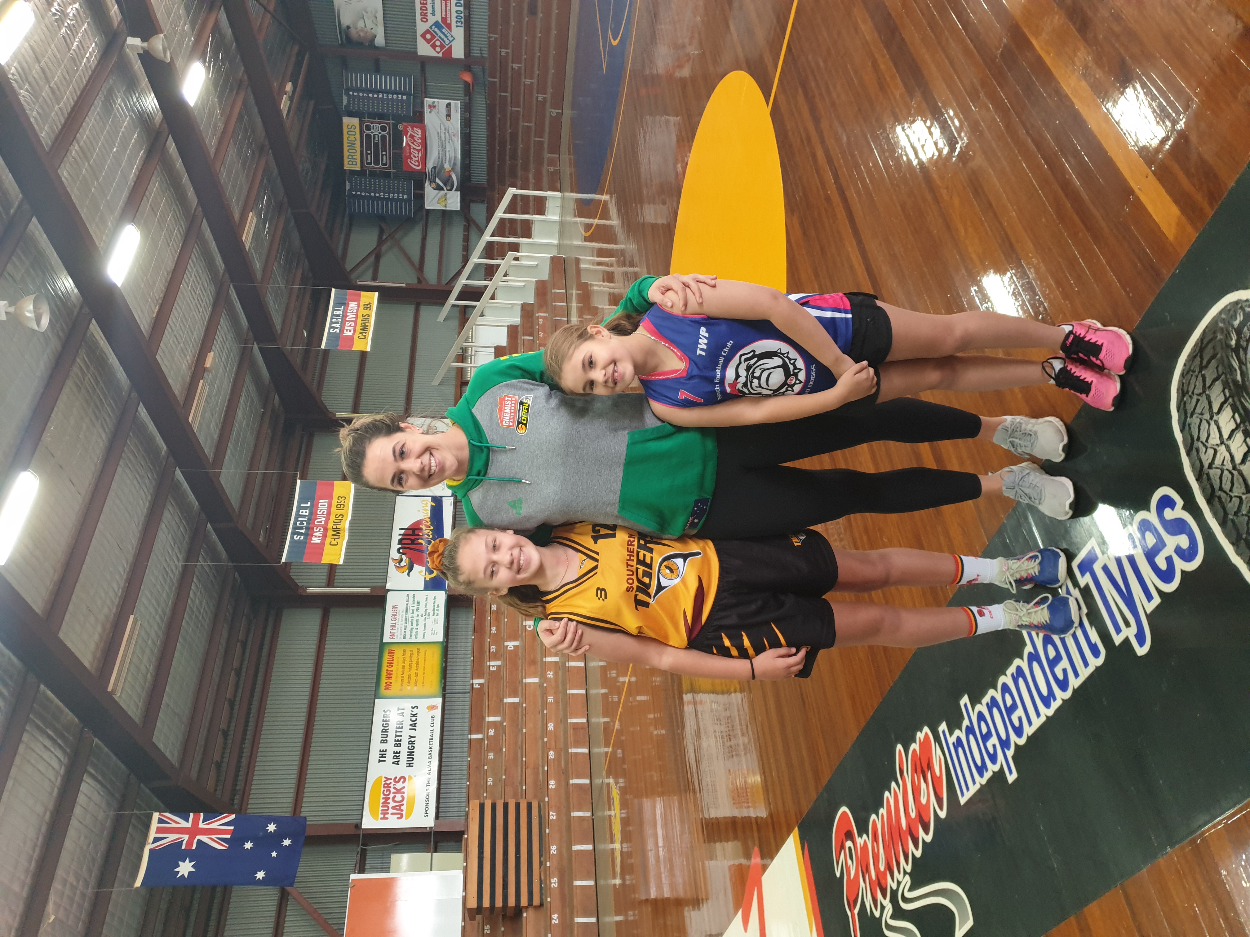 Jenna O'Hea with young basketballers