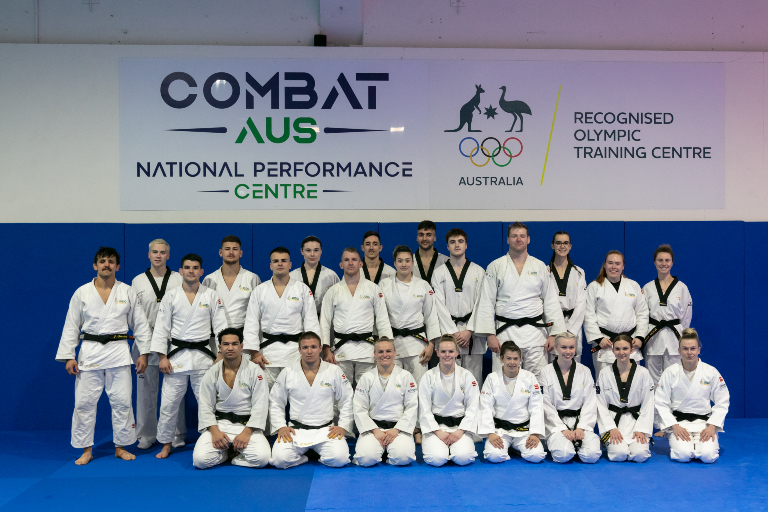 Athletes standing in front of National Performance Centre