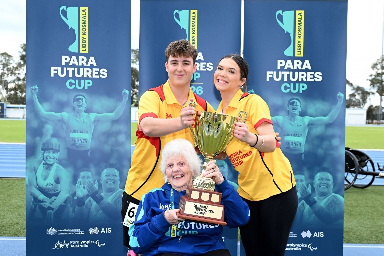 Libby Kosmala OAM with two Team West Para athletes holding the Para Futures Cup trophy.